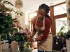 young black woman arranging fresh flowers